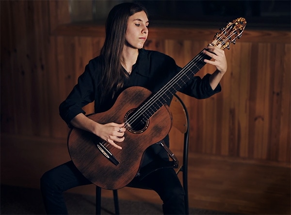 Girl playing Turkowiak classical guitar